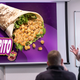 Illustration for article titled Sweating CornNuts VP Stammers Way Through Pitch For ‘Nutsarito’ At Taco Bellem/em